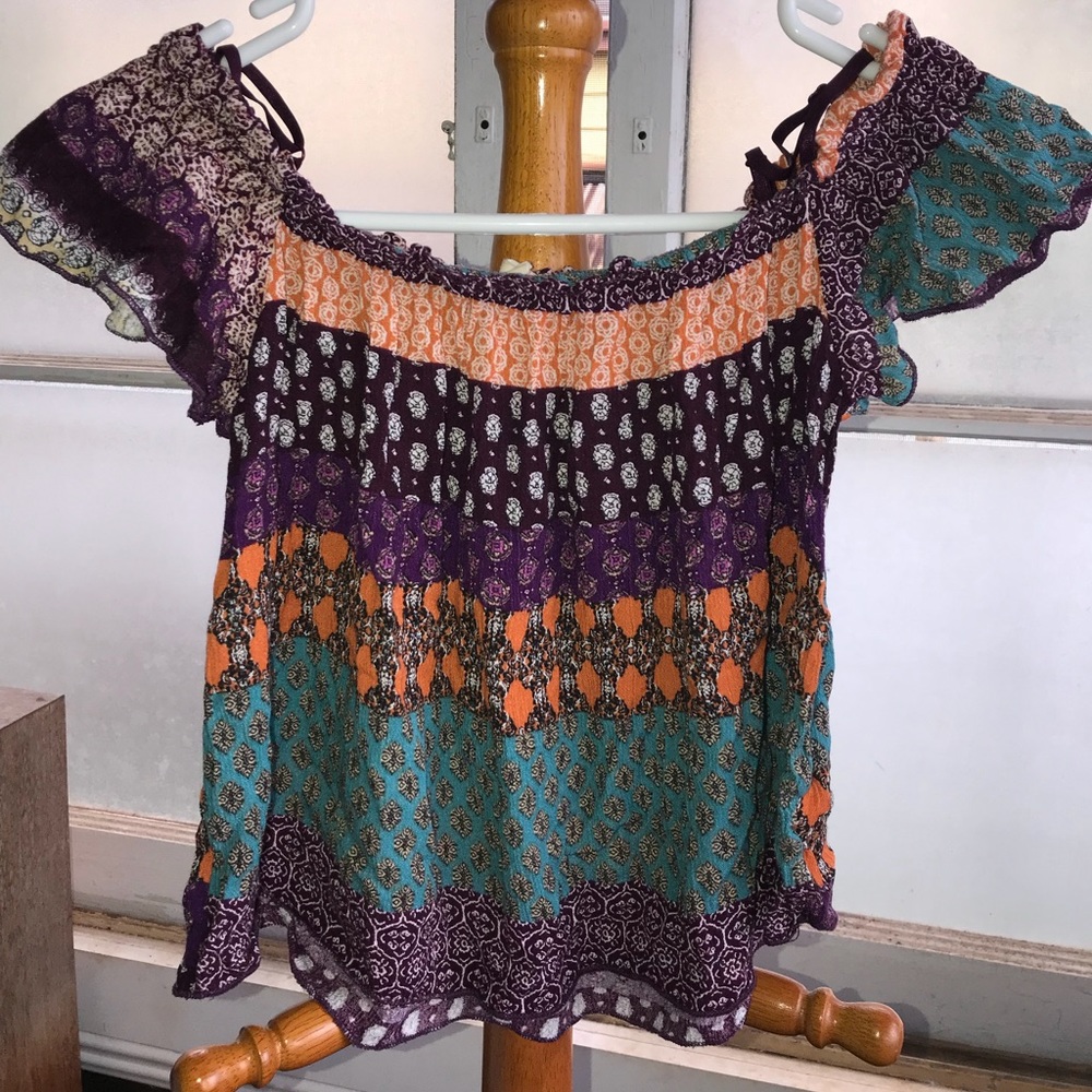 Cute gauzy off-shoulder crop top.